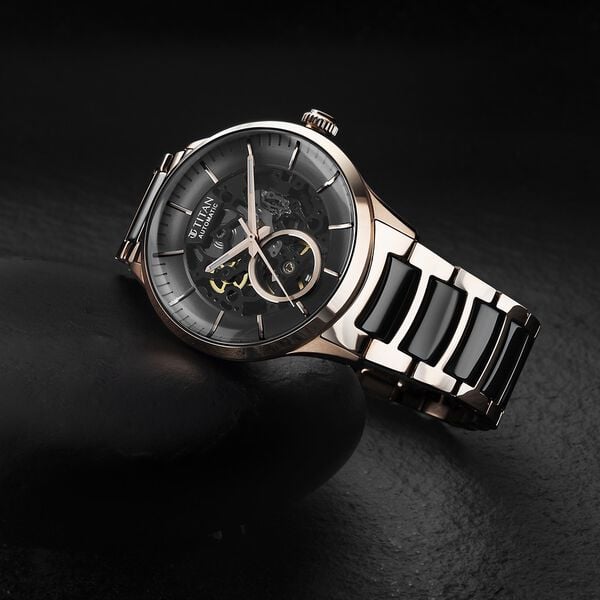 Titan 90174KD03 Men’s Automatic Analog Watch with Black Dial & Dual-Tone Stainless Steel Strap